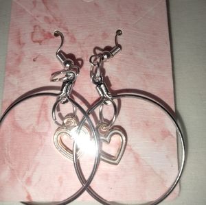 White hearts inside of the sterling silver hoop